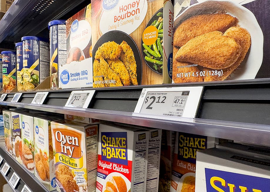 Digital price tags on display for the seasoning mix shelf in a grocery. — The Image Party // Shutterstock