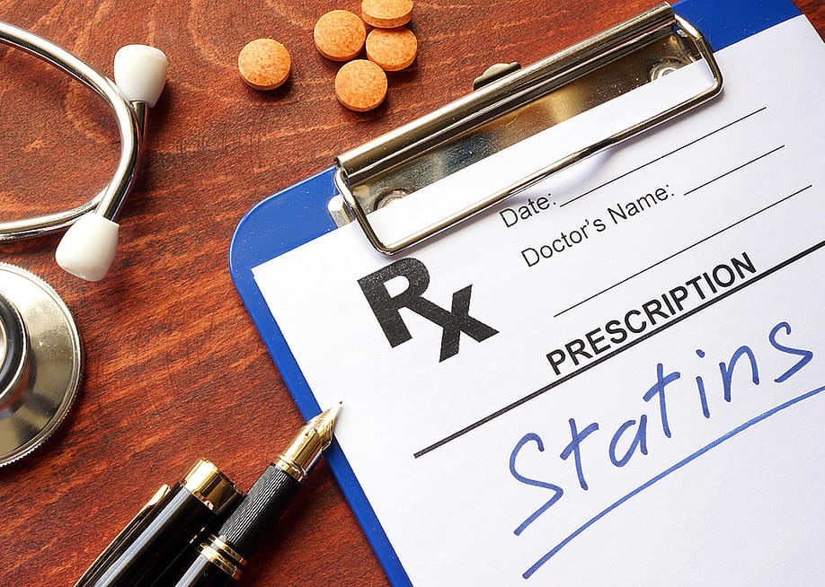 A clipboard with written prescription for 'statins'. — Vitalii Vodolazskyi // Shutterstock