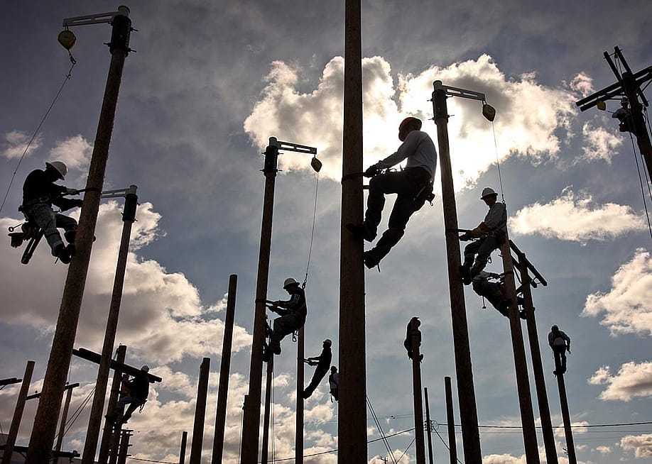 Technical College students climb 35 foottall wooden poles with a harness and spikes on their boots to train aloft with rigging to complete the 16 week course and earn a climbing certificate before moving into a apprentice position for the electric utility field. — Al Seib // Los Angeles Times via Getty Images