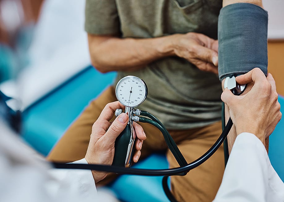 A senior man getting his blood pressure checked. — Drazen Zigic // Shutterstock