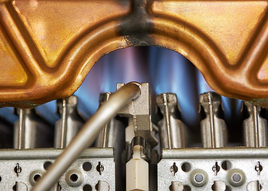 Close up of a water heater mechanism. — monte_a // Shutterstock