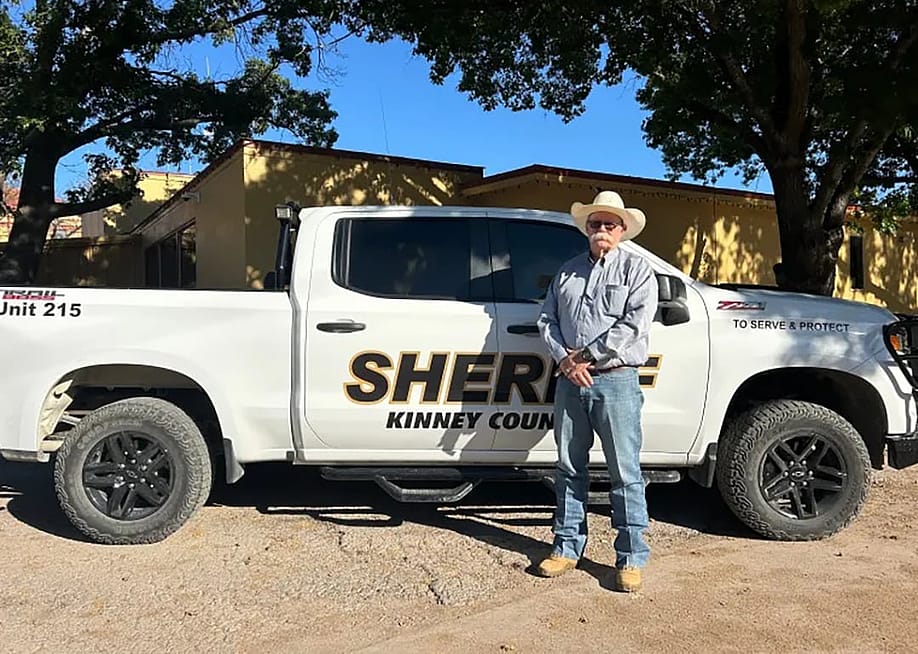 Sheriff Brad Coe of Kinney County, Texas, stands in front of his white truck, he is is one of hundreds of sheriffs who have signed on to collaborate with U.S. Customs and Border Enforcement (ICE) under the rapidly expanding Section 287(g) program. — Anya Petrone Slepyan for The Daily Yonder
