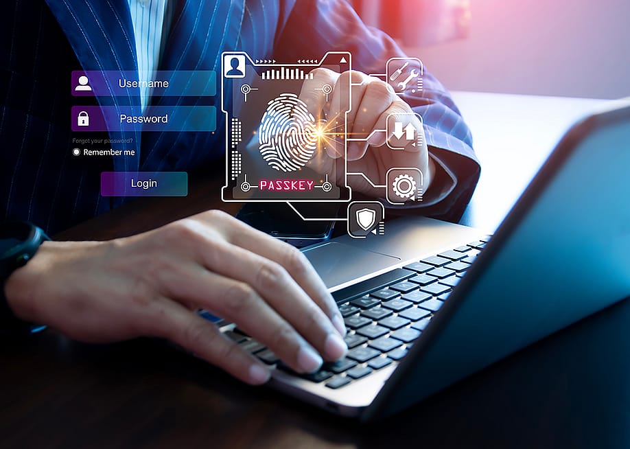 Person using a laptop illustrated with graphics of digital user login interface. — NMStudio789 // Shutterstock