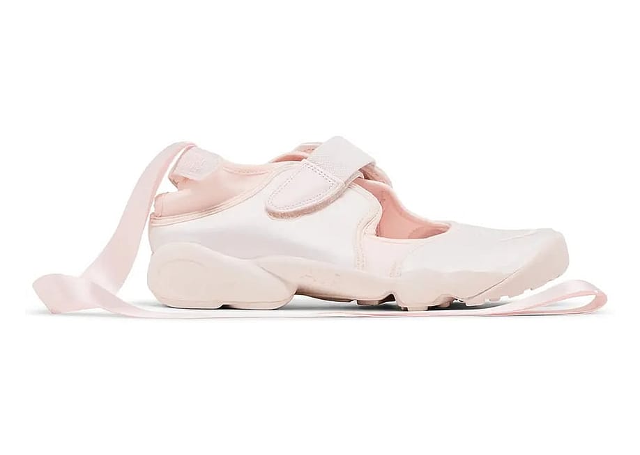 A side view of a Nike Air Rift ballerina shoe in light pink colorway. — Courtesy of Sneakers.com