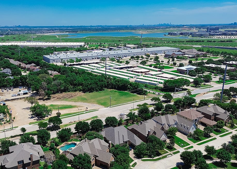 Aerial view of a mixed-use development along Belt Line boulevard outside Dallas Fort Worth, Texas. — Trong Nguyen // Shutterstock