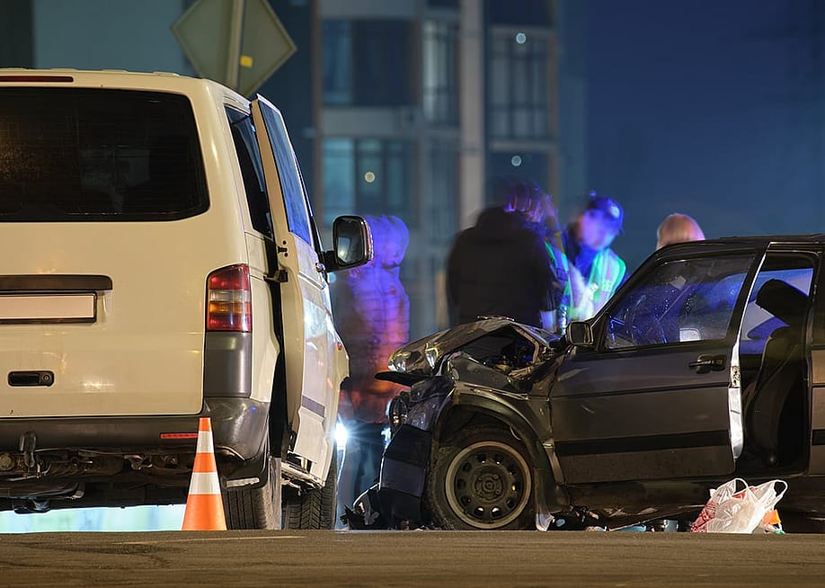 Cars crashed heavily in a road accident at night. — Bilanol // Shutterstock