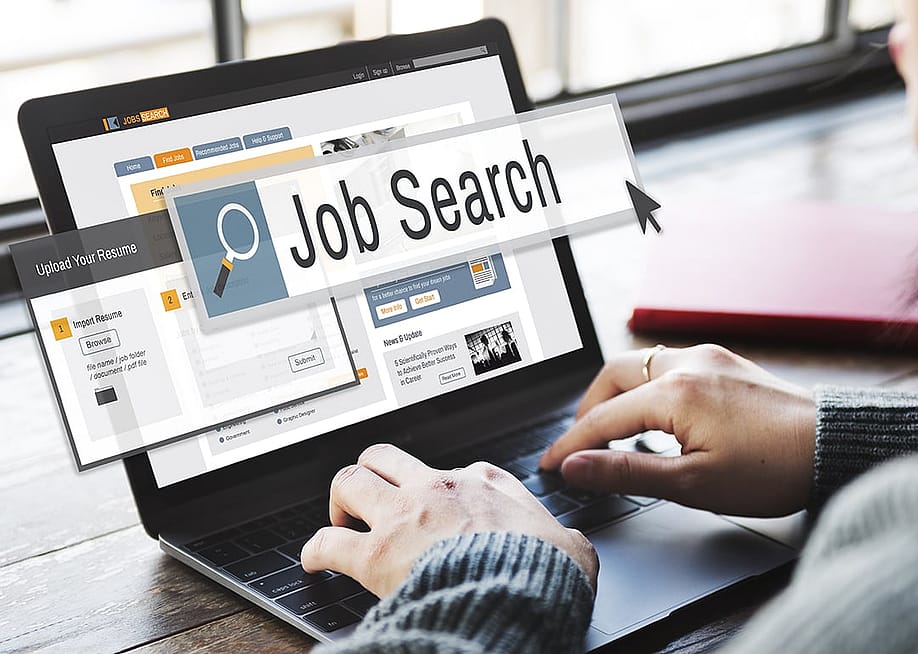 Job search display and graphics coming out of a person using a laptop. — Rawpixel.com // Shutterstock