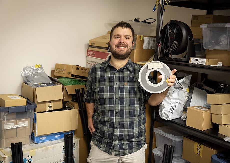 Aleks Maricq, a research associate at the University of Utah, holds the 9-track magnetic tape marked as containing a copy of UNIX Version 4, a foundational computer operating system, that he found in a storage room. — Dan Hixson // University of Utah