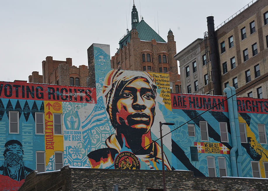 A Shepard Fairey-designed voting-rights mural rises over downtown Milwaukee, where voters and election officials remain under scrutiny for their election practices. — Alexander Shur // Votebeat