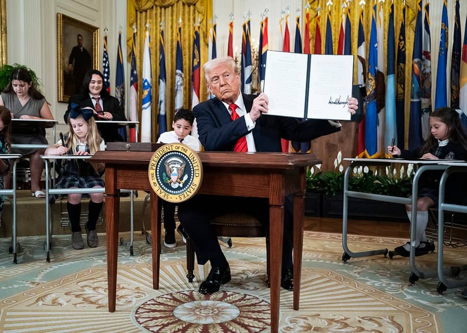 US President, Donald Trump, displaying a signed executive order aimed at closing the Education Department during an event at the White House on March 20, 2025 in Washington, D.C. — Jabin Botsford // The Washington Post via Getty Images