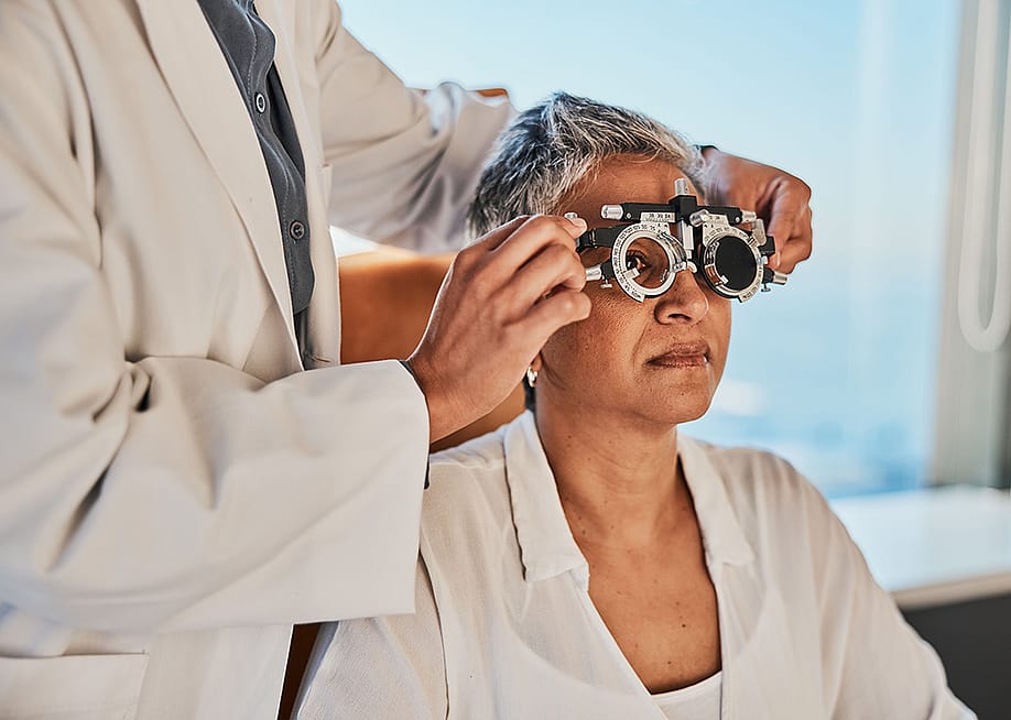 A senior woman getting a vision test for eyeglasses. — PeopleImages // Shutterstock