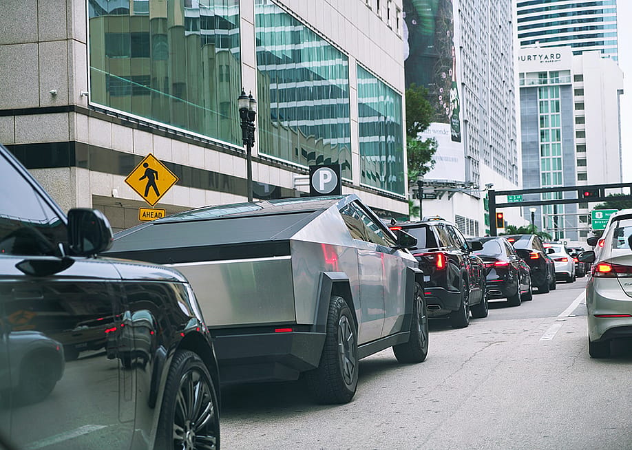 A Tesla Cybertruck stuck in a traffic in downtown Miami. — MikeDotta // Shutterstock
