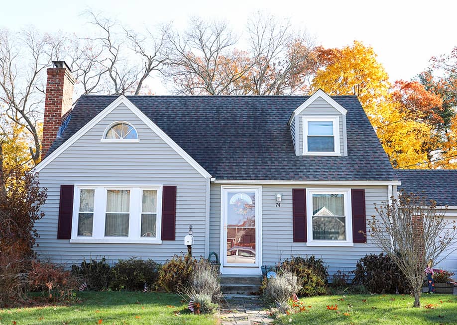 Facade of an American suburban home. — Your Hand Please // Shutterstock
