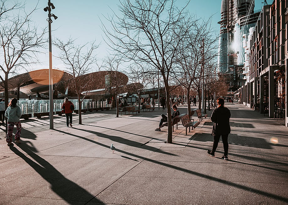 People along a walkway during wintertime. — juancsanchezherrera // Shutterstock