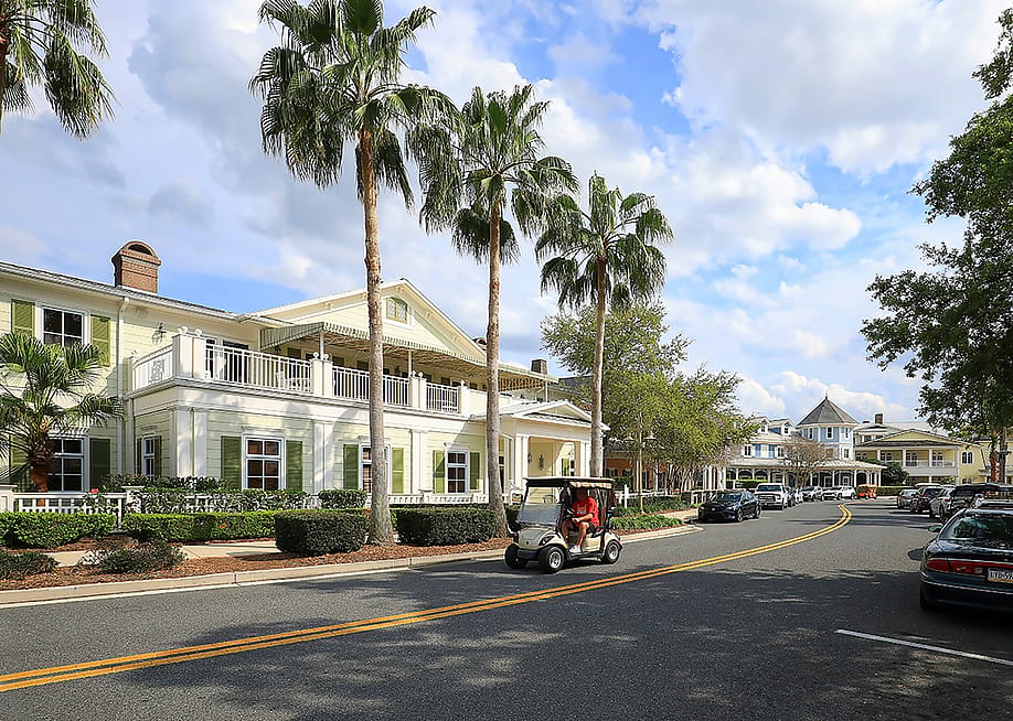 View of a road in The Villages, a popular retirement golf cart-loving community in Florida. — Jillian Cain Photography // Shutterstock