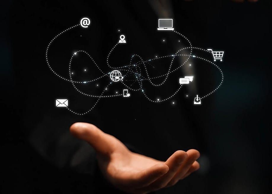 A network of marketing and communication concept icons over a person's hand. — Digineer Station // Shutterstock