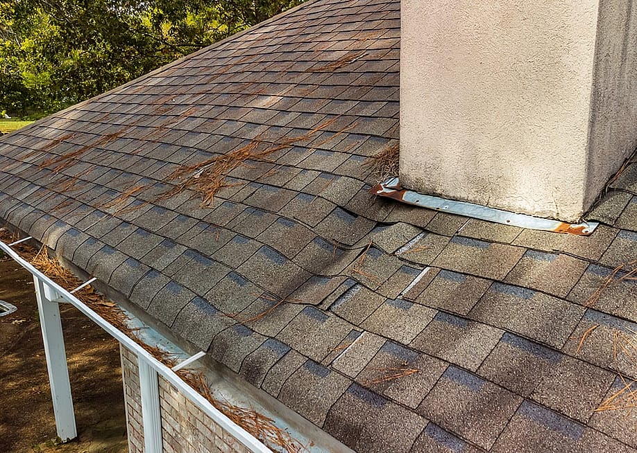 Roof and shingles damaged from water leak. — Chad Robertson Media // Shutterstock