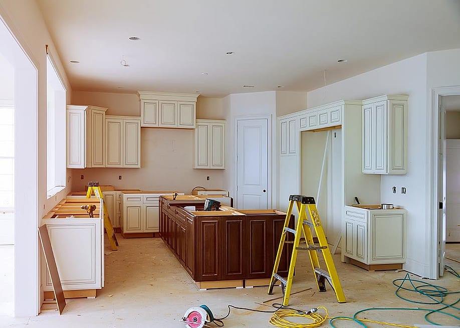 New cabinet installment in progress for a modern kitchen. — ungvar // Shutterstock