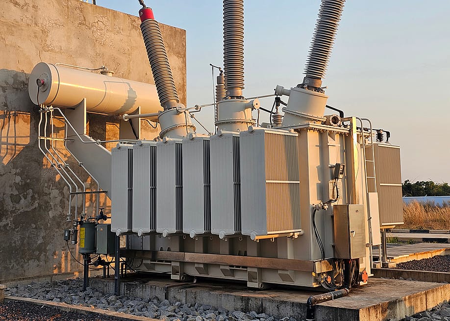 A three-phase 115kV power transformer. — Chaitawat Chuayin // Shutterstock