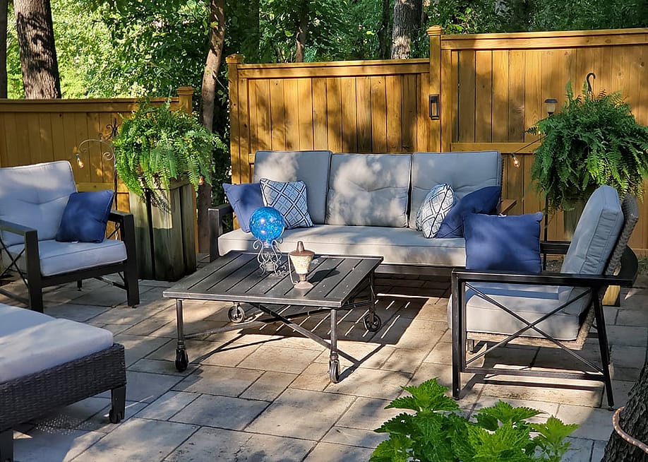 A patio with modern furniture during the afternoon. — BigDaveBo // Shutterstock
