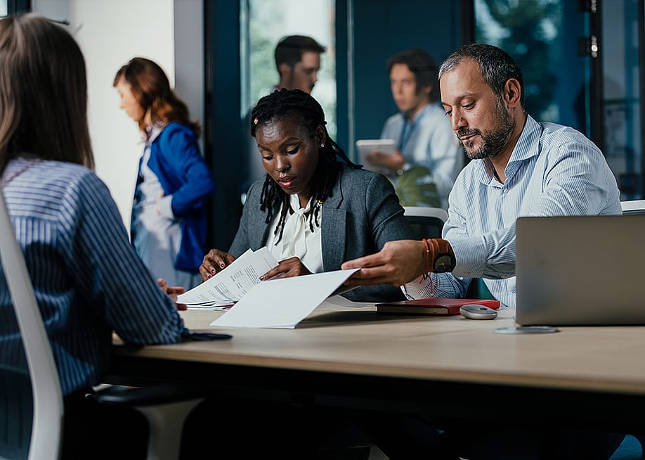 A small diverse business team project planning in a modern office. — Suteren Studio // Shutterstock