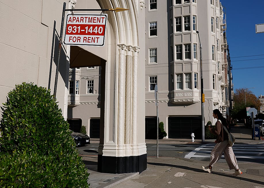 An apartment for rent sign hangs outside of an apartment building in San Francisco, California. — Justin Sullivan // Getty Images