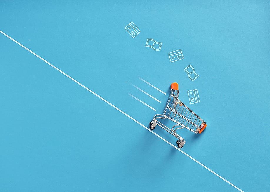 A shopping cart going down a line as a concept of fast shopping checkout. — Cagkan Sayin // Shutterstock