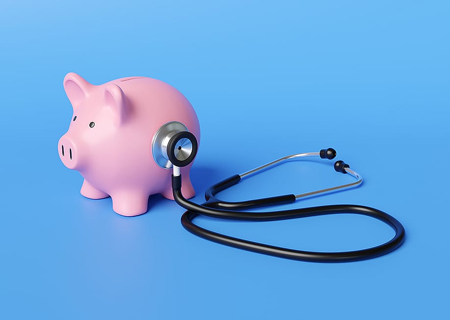 A piggy bank with a stethoscope. — Dragon Claws // Shutterstock