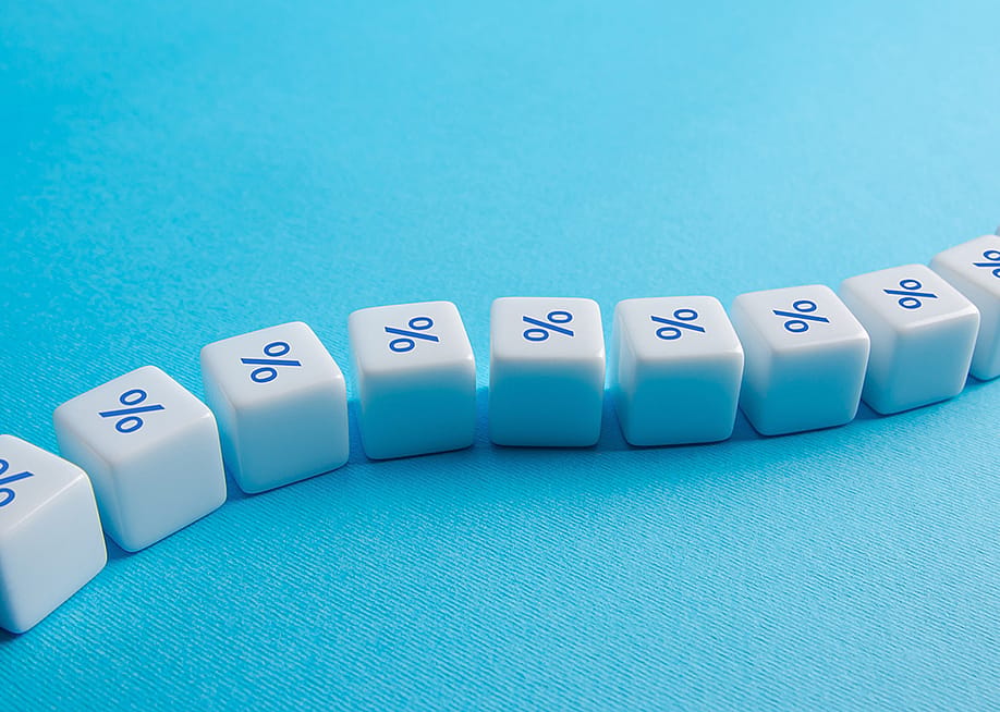 A chain of blocks with the percentage symbol. — Andrii Yalanskyi // Shutterstock