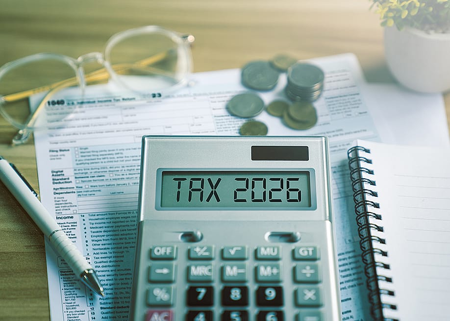 Calculator showing 'tax 2026' over tax documents. — Sutthiphong Chandaeng // Shutterstock
