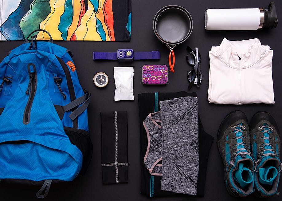 A flat lay set of hiking gear and essentials. — Gorgany // Shutterstock