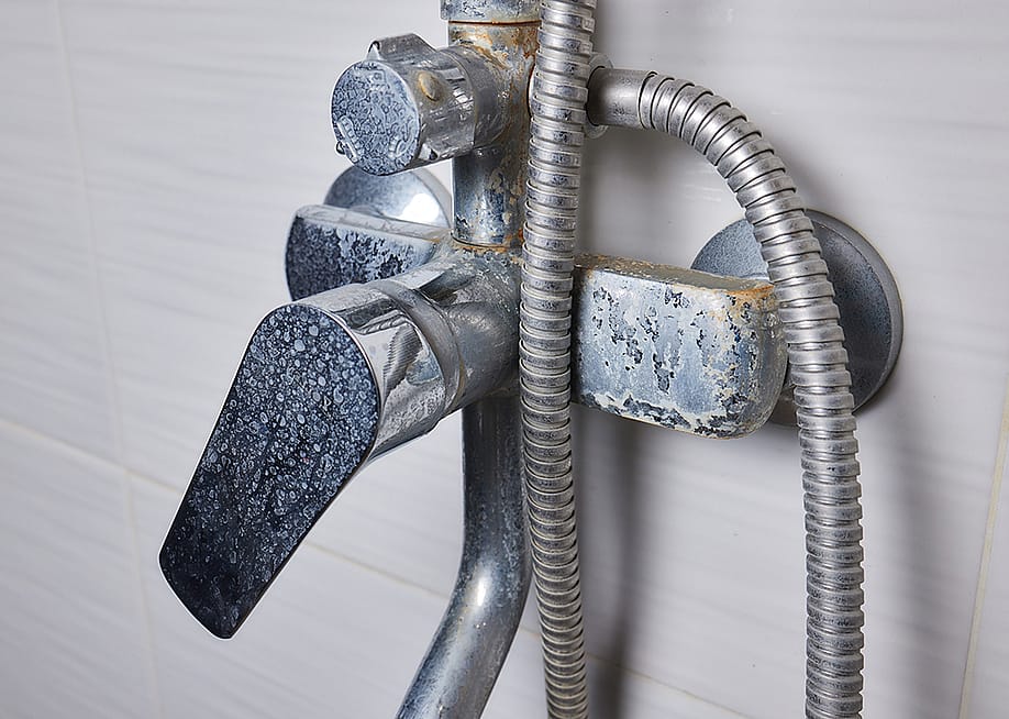 An old tap aerator with marks of hard water. — Vershinin89 // Shutterstock