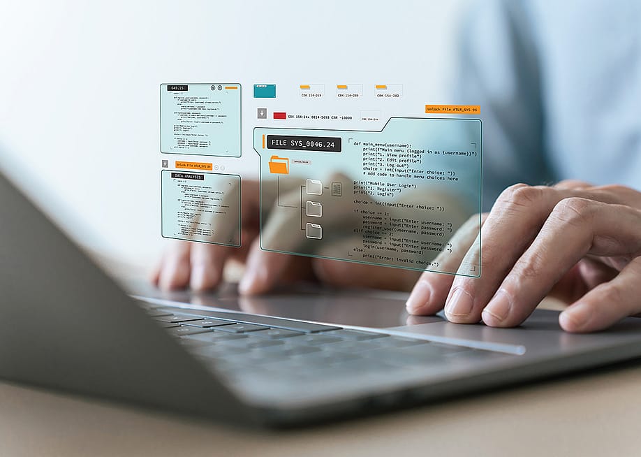Person typing on a laptop keyboard illustrated with programming app graphics. — Koto Amatsukami // Shutterstock