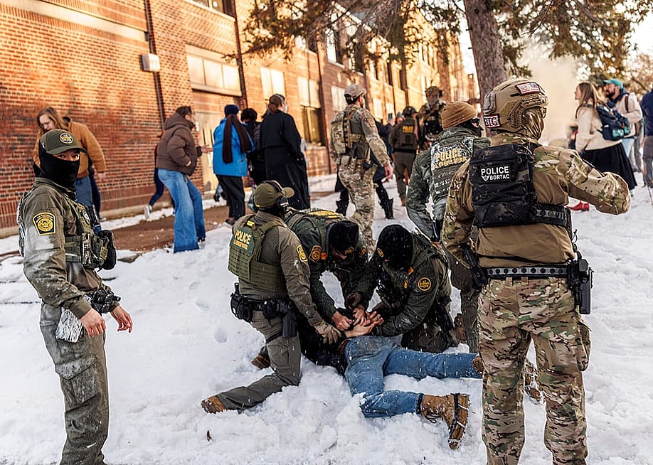 US Border Patrol / ICE agents detain a person near Roosevelt High School during dismissal time as federal immigration enforcement actions sparked protests in Minneapolis, Minnesota, on January 7, 2026. — Kerem YUCEL // AFP via Getty Images