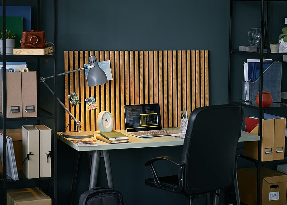 A modern home office setup featuring a wooden desk. — SeventyFour // Shutterstock
