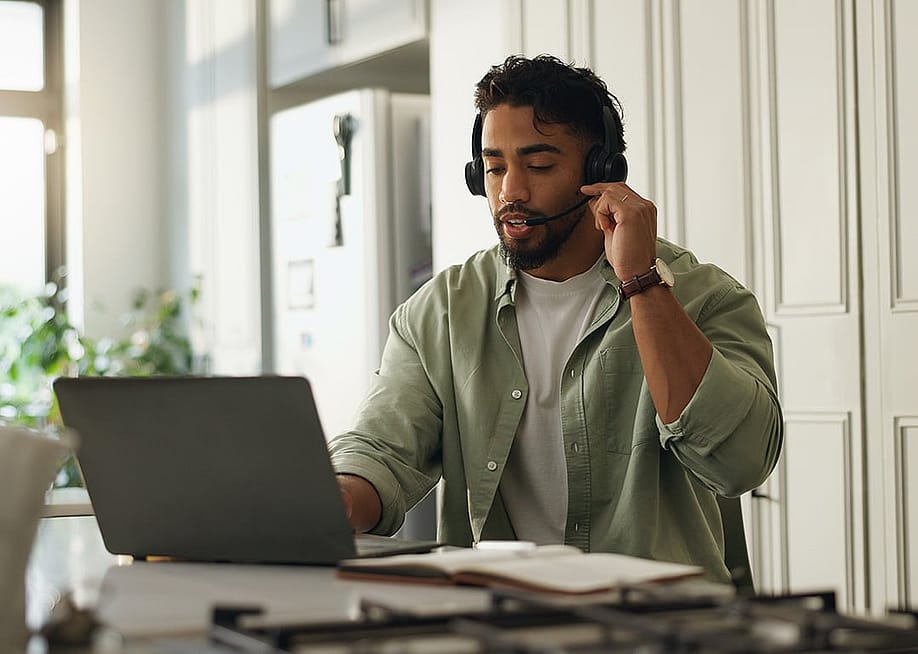A customer service agent working from home. — PeopleImages // Shutterstock