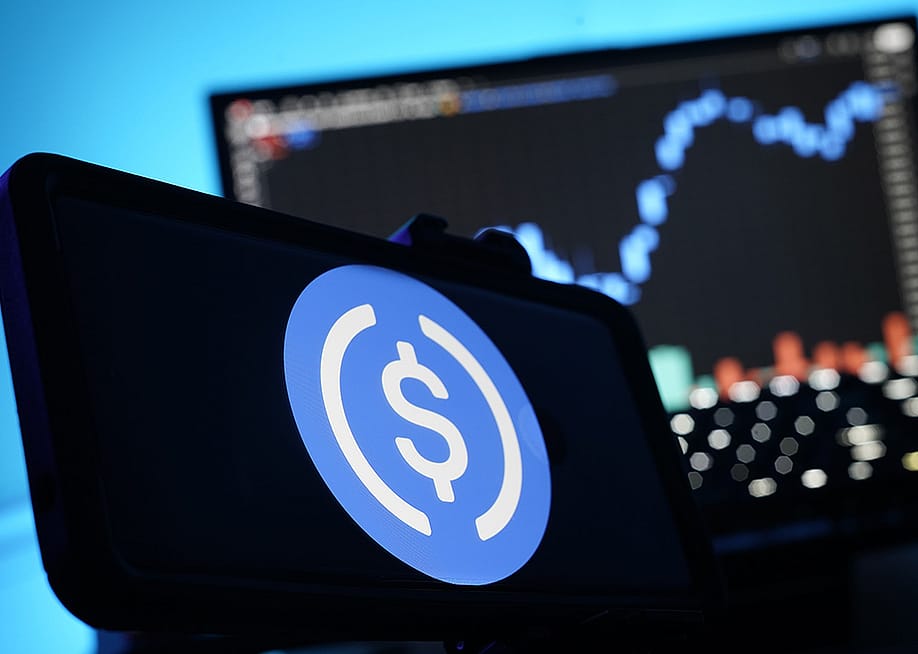 A stablecoin logo displayed on a smartphone. — McDonnell // Shutterstock