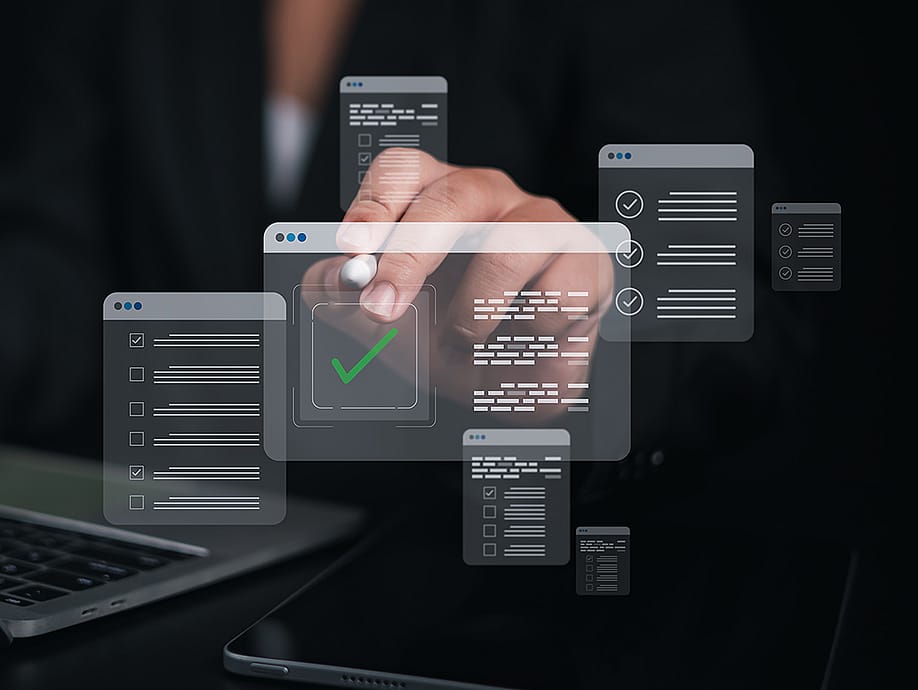 A person using a laptop which shows a checklist and filling survey forms online. — Ao Zaa Studio // Shutterstock