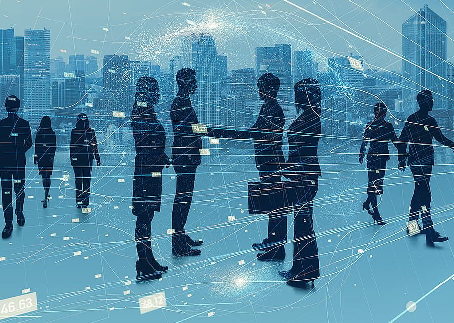Digital illustration showing silhouettes of businesspeople meeting together and designed with network graphics. — metamorworks // Shutterstock