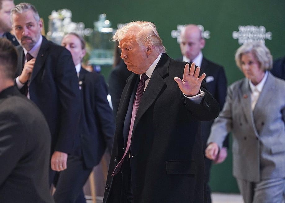 US President Donald Trump waves at the press, who appeared to be frowning in a world summit in Davos, Switzerland. — Peng Ziyang // Xinhua via Getty Images