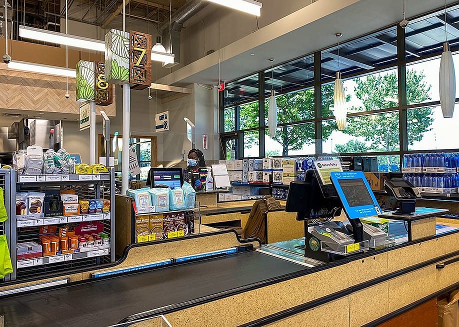 The checkout counter of a Whole Foods grocery store. — Joni Hanebutt // Shutterstock