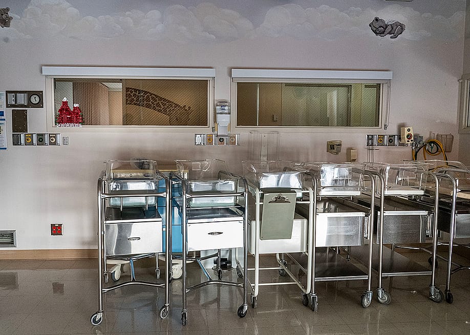 Empty infant beds in a corner of a maternity ward. — Melina Mara // The Washington Post via Getty Images