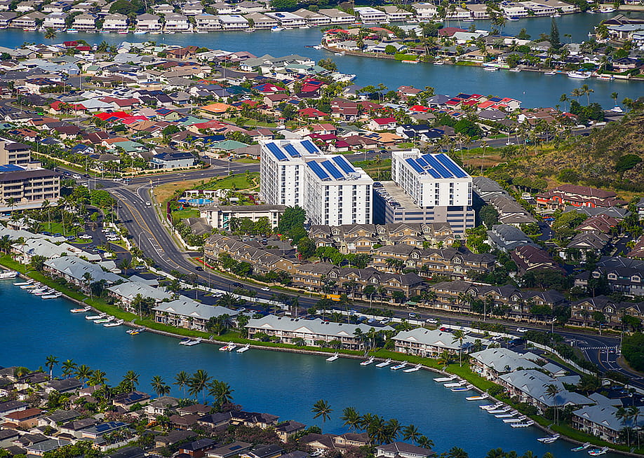 Aerial view of apartment buildings in a residential neighborhood in Hawai'i. — Alexandre.ROSA // Shutterstock