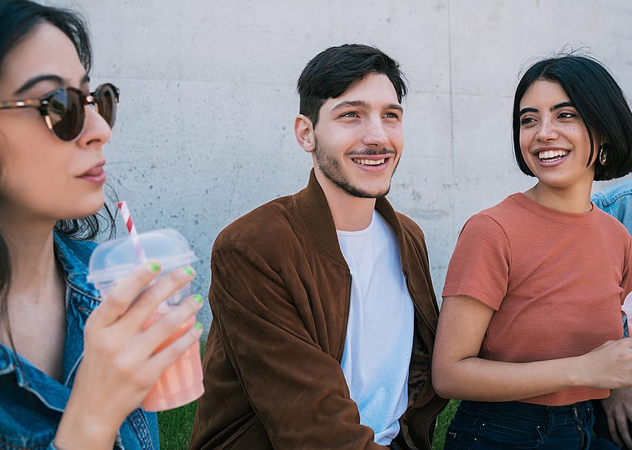 A group of friends having fun together over drinks. — Mix Tape // Shutterstock