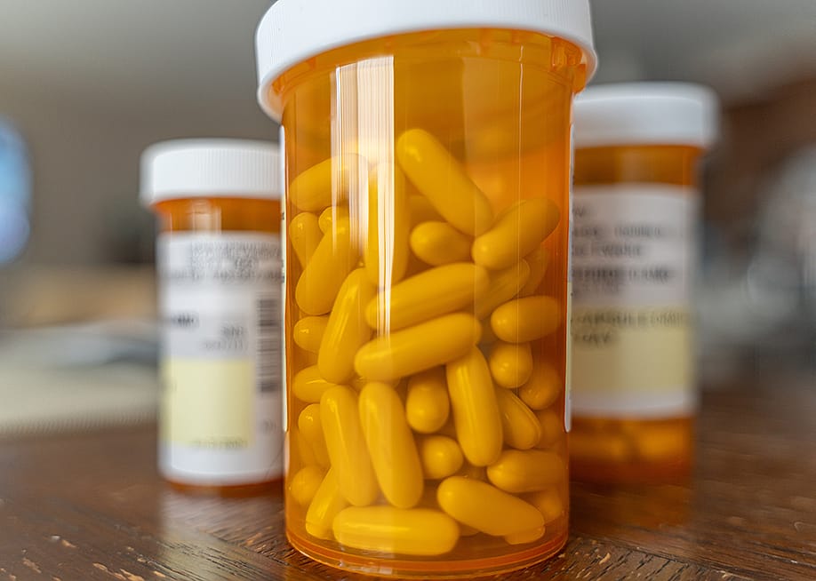 Bottles of prescription capsules. — Primestock Photography // Shutterstock