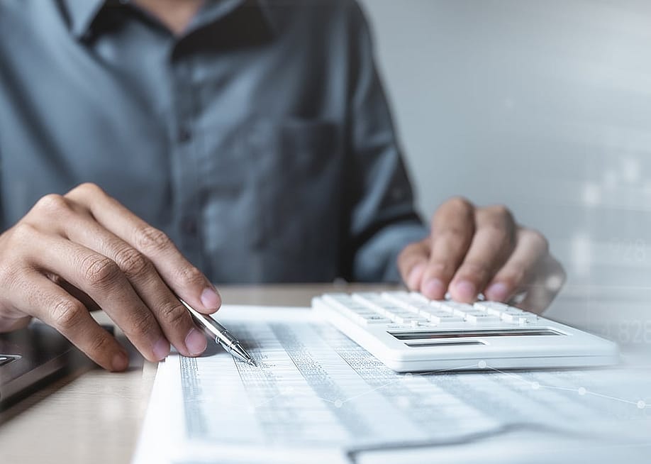 An accountant analyzing financial documents. — Garun .Prdt // Shutterstock