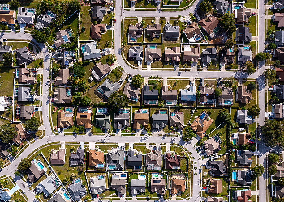 An aerial view of residential houses in the Tampa suburbs in Florida, USA. — Gianfranco Vivi // Shutterstock