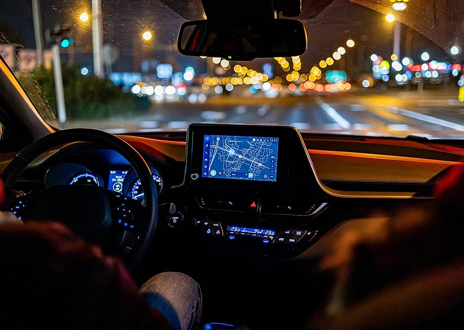 An interior view of a person driving a modern car. — JaceKo77 // Shutterstock