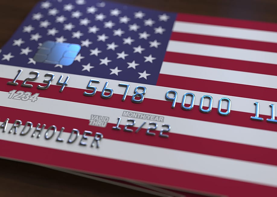 A bank card featuring the United States of America's flag. — Novikov Aleksey // Shutterstock