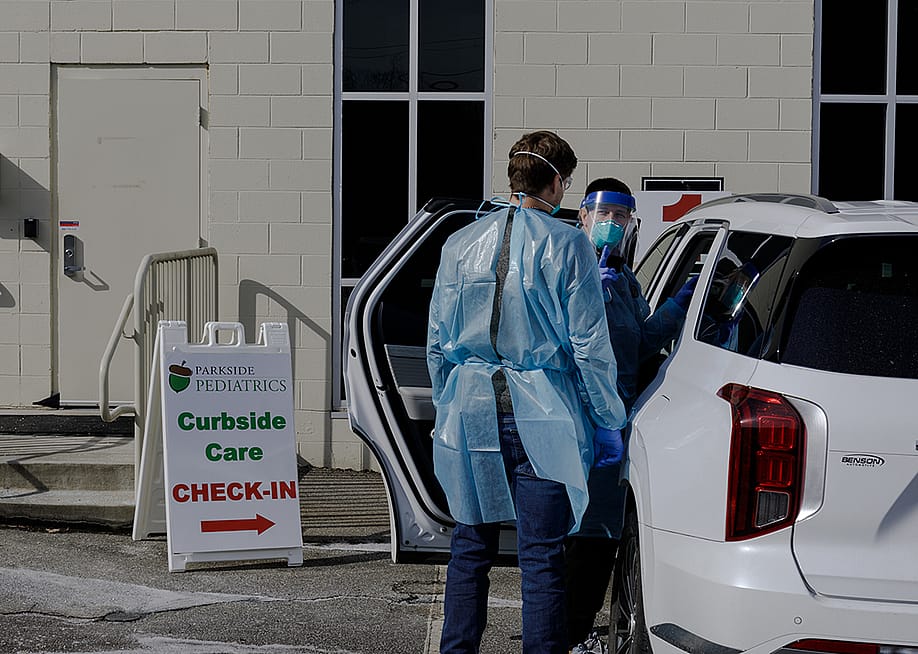 Parkside Pediatrics providers assessing a patient with measles symptoms in Spartanburg, South Carolina, US. — Juan Diego Reyes // The Washington Post via Getty Images